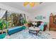 Cozy living room featuring a large window providing natural light and a view of lush greenery at 2141 Rio De Janeiro Ave, Punta Gorda, FL 33983
