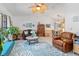 Bright living room with vaulted ceilings, a ceiling fan, comfortable seating, and large windows at 2141 Rio De Janeiro Ave, Punta Gorda, FL 33983