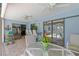 Charming covered patio with a glass table, comfortable seating, and easy access to the pool at 2141 Rio De Janeiro Ave, Punta Gorda, FL 33983