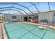 A large screened-in pool with patio furniture, perfect for outdoor relaxation and entertaining guests at 2141 Rio De Janeiro Ave, Punta Gorda, FL 33983