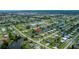 An aerial view showcases the property's location near a waterway and neighborhood amenities at 21539 Gladis Ave, Port Charlotte, FL 33952