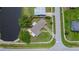 Aerial view of house highlighting a waterfront property with lush greenery and patio area at 21539 Gladis Ave, Port Charlotte, FL 33952