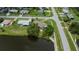 Aerial view of the home showcasing its waterfront location and convenient street access at 21539 Gladis Ave, Port Charlotte, FL 33952