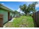 Wide open backyard with view of shade tree and waterfront, perfect for a relaxing evening at 21539 Gladis Ave, Port Charlotte, FL 33952