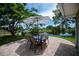 Backyard patio featuring outdoor seating and lovely pond view at 21539 Gladis Ave, Port Charlotte, FL 33952
