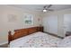 A cozy bedroom with a starfish themed bedspread, light walls and wood-look floors at 21539 Gladis Ave, Port Charlotte, FL 33952