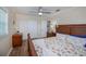 Charming bedroom with wood floors, closet space, and a starfish patterned comforter at 21539 Gladis Ave, Port Charlotte, FL 33952