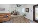 Open-concept dining room with wood-look floors, natural light, and a dining table perfect for Gathering gatherings at 21539 Gladis Ave, Port Charlotte, FL 33952