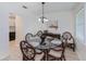 Well lit dining room featuring tile floors, wicker chairs, and a glass top table at 21539 Gladis Ave, Port Charlotte, FL 33952