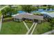 Charming single-story home featuring a well-maintained lawn, fenced yard, and convenient two-car garage at 21539 Gladis Ave, Port Charlotte, FL 33952