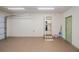 Clean two car garage with an interior entrance to the main house and an exterior door at 21539 Gladis Ave, Port Charlotte, FL 33952