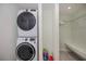 Efficient laundry area with stacked washer/dryer and built in closet space at 21539 Gladis Ave, Port Charlotte, FL 33952
