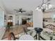 Spacious living room featuring modern ceiling fans and wood flooring at 21539 Gladis Ave, Port Charlotte, FL 33952