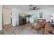 Comfortable living room area with a TV, potted tree, and coastal decor at 21539 Gladis Ave, Port Charlotte, FL 33952
