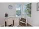 Office space featuring a view of a lake from the window, white wicker desk and chair at 21539 Gladis Ave, Port Charlotte, FL 33952