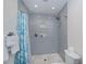 Bathroom featuring a stylish standing shower with tile surround and built-in niche at 21539 Gladis Ave, Port Charlotte, FL 33952