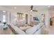 Bright living room showcasing a sectional sofa, stylish furnishings, and modern decor at 2308 Oberon Ln, Punta Gorda, FL 33983