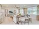 Inviting living room with natural light, a large sectional sofa, and stylish decor at 2308 Oberon Ln, Punta Gorda, FL 33983