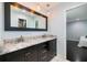 Ensuite bathroom featuring double vanity with marble countertops and modern finishes at 2309 Conway Blvd, Port Charlotte, FL 33952