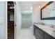 Ensuite bathroom featuring double vanity, tile shower and marble countertops at 2309 Conway Blvd, Port Charlotte, FL 33952