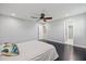 Bedroom featuring ceiling fan, neutral walls, closet and door to ensuite bathroom at 2309 Conway Blvd, Port Charlotte, FL 33952