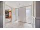 A bright and welcoming foyer featuring tile flooring and a view to the kitchen at 2309 Conway Blvd, Port Charlotte, FL 33952