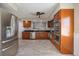 Spacious kitchen featuring stainless steel appliances, a double oven, and granite countertops at 2309 Conway Blvd, Port Charlotte, FL 33952