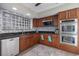 Updated kitchen with modern appliances, granite countertops, and stylish backsplash at 2309 Conway Blvd, Port Charlotte, FL 33952