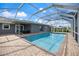 Screened-in pool and patio area, perfect for outdoor entertaining at 2309 Conway Blvd, Port Charlotte, FL 33952