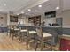 Resident bar with seating, cabinetry and liquor storage with a beer tap system at 24132 Buckingham Way, Punta Gorda, FL 33980