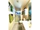 Nicely arranged bathroom featuring a glass-enclosed shower, vanity with storage, and neutral color palette at 24132 Buckingham Way, Punta Gorda, FL 33980