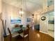 Charming dining area featuring hardwood floors and a view of the adjacent living spaces at 24132 Buckingham Way, Punta Gorda, FL 33980