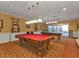 Spacious game room with a pool table, billiard table, and ample lighting for entertainment and recreation at 24132 Buckingham Way, Punta Gorda, FL 33980