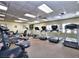 Well-equipped gym with treadmills, stationary bikes, and other fitness equipment in a bright, spacious setting at 24132 Buckingham Way, Punta Gorda, FL 33980