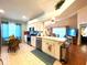 Well-lit kitchen featuring stainless steel appliances, and open floorplan to the living room at 24132 Buckingham Way, Punta Gorda, FL 33980