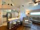 Comfortable living room with bar seating, stainless appliances, and an adjacent seating area at 24132 Buckingham Way, Punta Gorda, FL 33980
