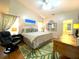 Spacious main bedroom with vaulted ceiling, complemented by hardwood floors and ensuite bathroom at 24132 Buckingham Way, Punta Gorda, FL 33980