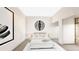 Contemporary bedroom with minimalist decor, modern lighting, and closet space at 24317 Treasure Island Blvd, Punta Gorda, FL 33955