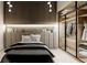 Cozy bedroom featuring a modern headboard and a sleek, glass-enclosed closet at 24317 Treasure Island Blvd, Punta Gorda, FL 33955