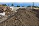 Image displays a construction site with a foundation and piles of earth for landscaping at 24317 Treasure Island Blvd, Punta Gorda, FL 33955