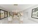 Dining and living area with ample seating, modern decor, and bright lighting at 24317 Treasure Island Blvd, Punta Gorda, FL 33955