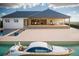 Luxury home with a private pool and covered patio, perfect for outdoor entertaining with stunning views at 24317 Treasure Island Blvd, Punta Gorda, FL 33955