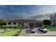 Newly built single-story home with a two-car garage and manicured landscaping at 24317 Treasure Island Blvd, Punta Gorda, FL 33955
