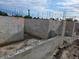 Construction progress showing a solid concrete block foundation with rebar supports at 24317 Treasure Island Blvd, Punta Gorda, FL 33955