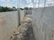 New home construction shows concrete block foundation with vertical rebar supports at 24317 Treasure Island Blvd, Punta Gorda, FL 33955