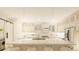 Bright modern kitchen with an island, stainless appliances, and counter seating at 24317 Treasure Island Blvd, Punta Gorda, FL 33955