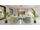 Bright living room featuring modern furniture, plants, and plenty of natural light at 24317 Treasure Island Blvd, Punta Gorda, FL 33955