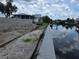 Waterfront property under construction with canal views and private dock under construction at 24317 Treasure Island Blvd, Punta Gorda, FL 33955
