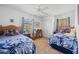 Comfortable bedroom featuring two twin beds, a ceiling fan, and lots of natural light at 2455 Jacoby Cir, North Port, FL 34288