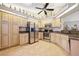 Spacious kitchen featuring stainless steel appliances and ample cabinet space with accent lighting at 2455 Jacoby Cir, North Port, FL 34288